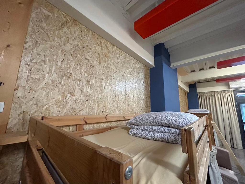 Postel nebo postele na pokoji v ubytování Miaoli Sanyi Travelling Homestay