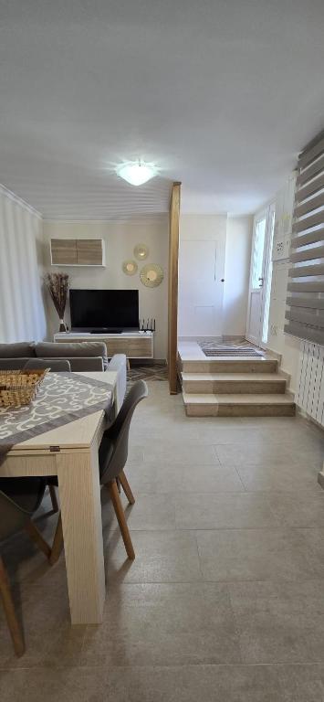 a living room with a couch and a table at La Casetta in Pescolanciano