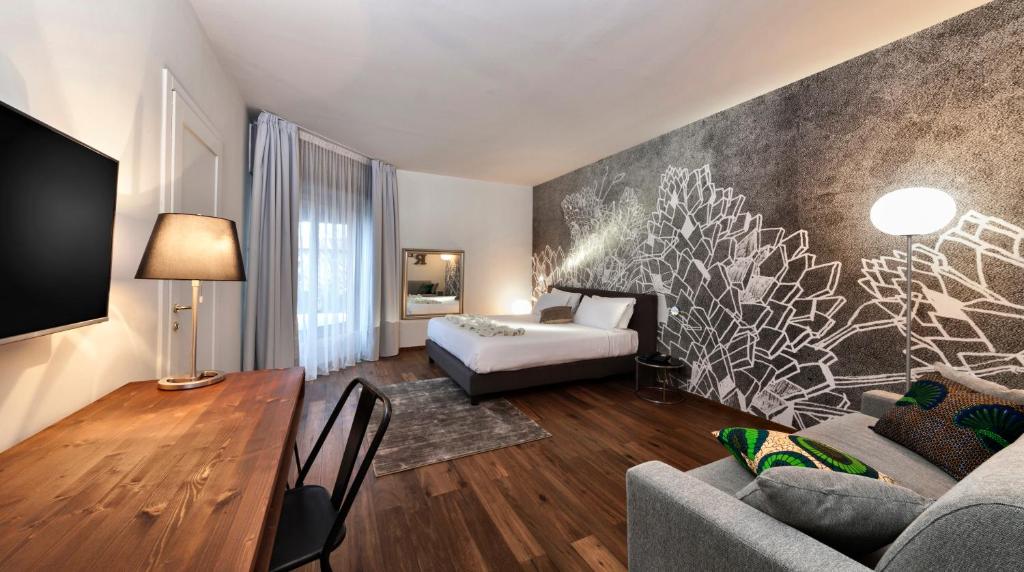 Postel nebo postele na pokoji v ubytování Living Hotel Milano