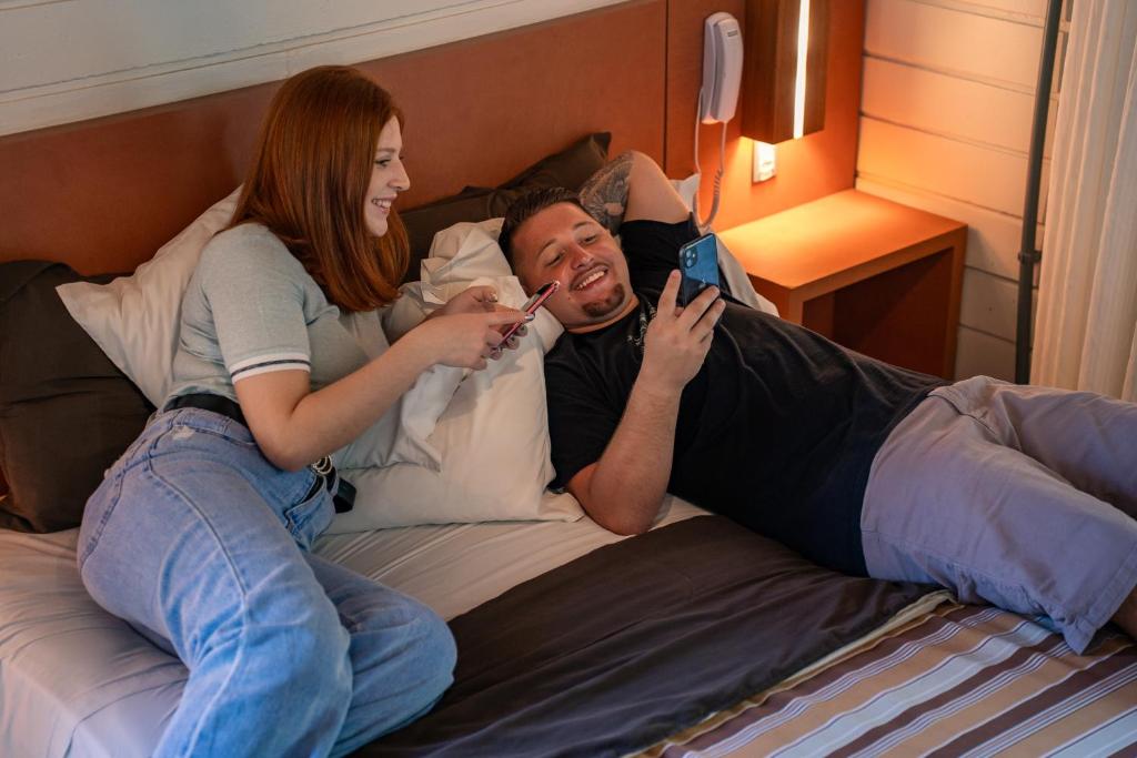 Postel nebo postele na pokoji v ubytování Hotel Acqua Lokos