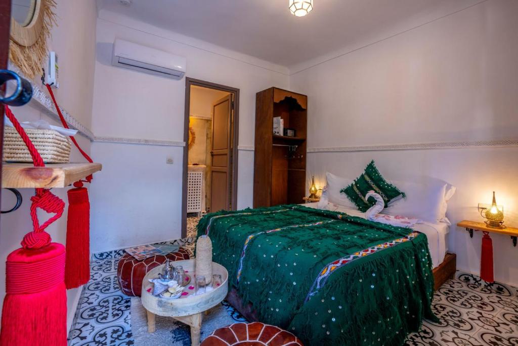 Postel nebo postele na pokoji v ubytování Riad Nowara Marrakech