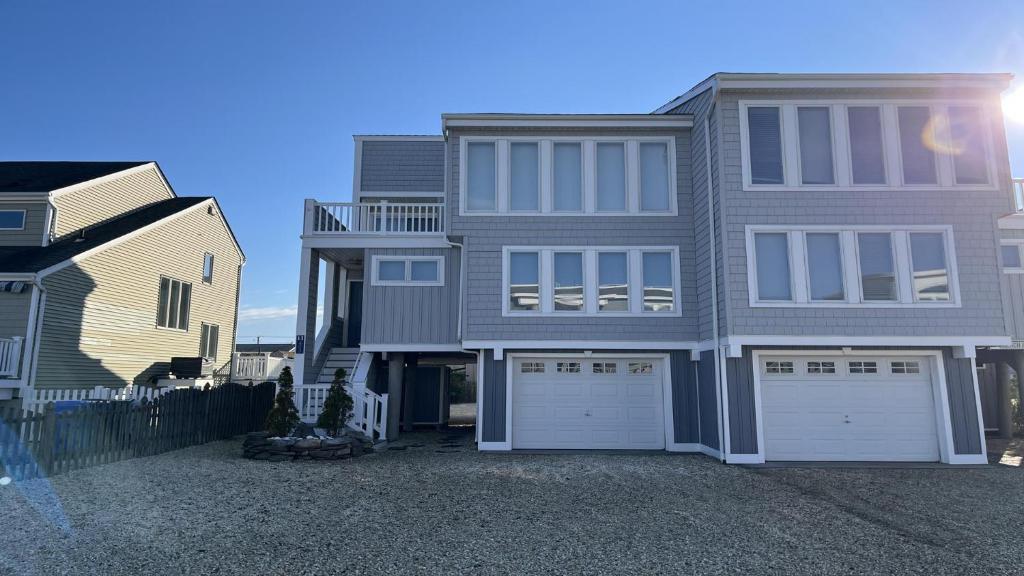 a large house with two garages in front of it at Pavloski in Beach Haven