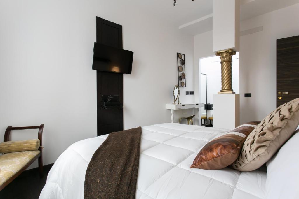 Postel nebo postele na pokoji v ubytování Aparthotel Dei Mercanti
