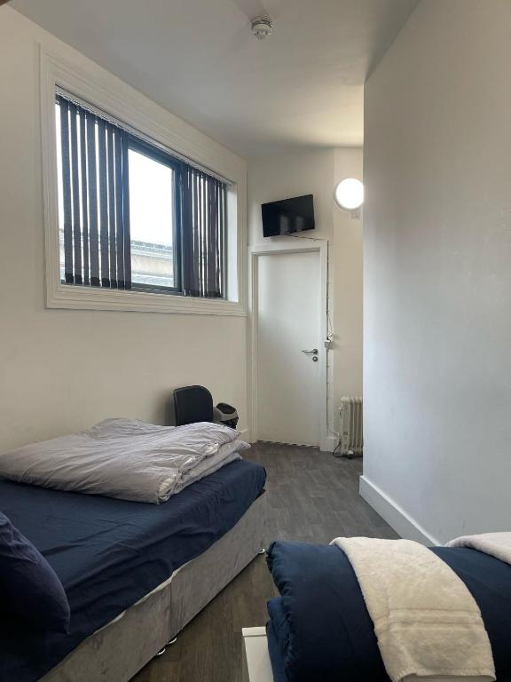 Postel nebo postele na pokoji v ubytování Rahman Hostel
