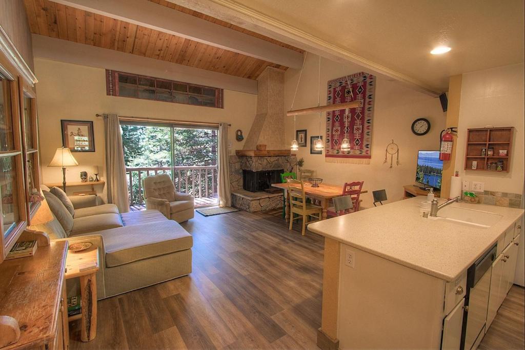 a kitchen and living room with a couch and a table at Cheyenne's Place home in Kings Beach