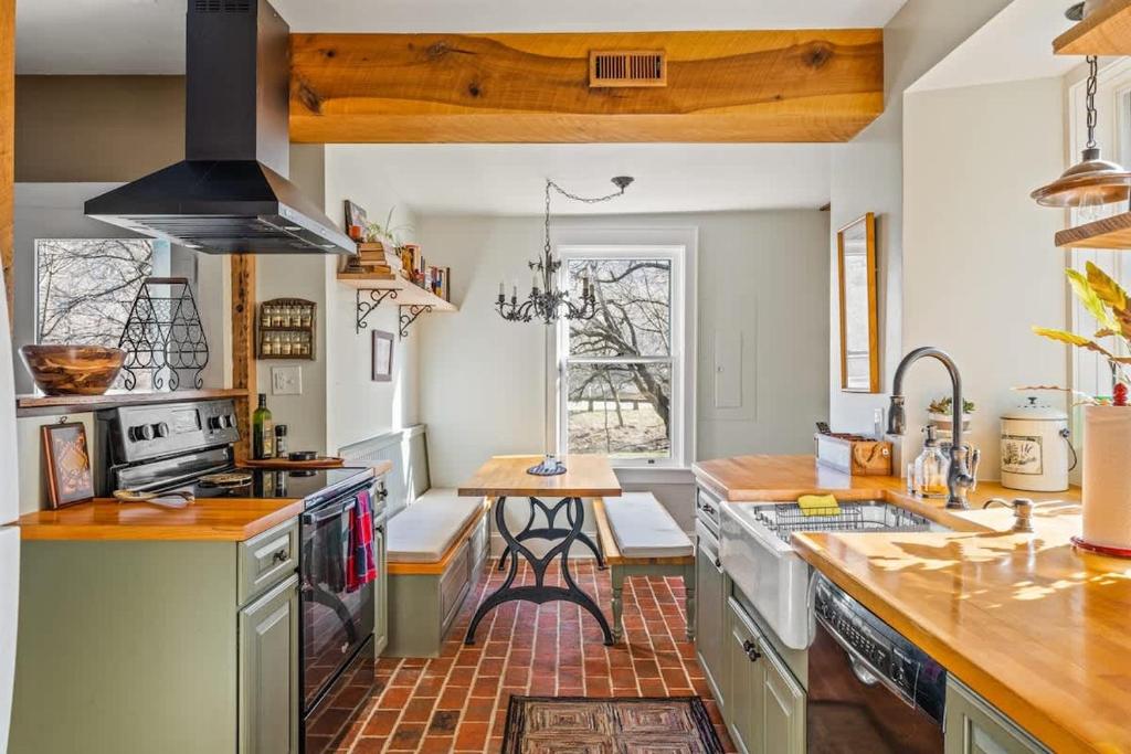 a kitchen with a stove and a counter top at Minutes to Downtown Harpers Ferry Hot Tub in Bolivar