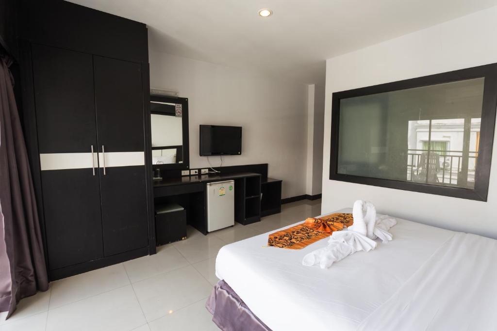 Postel nebo postele na pokoji v ubytování Star House Patong