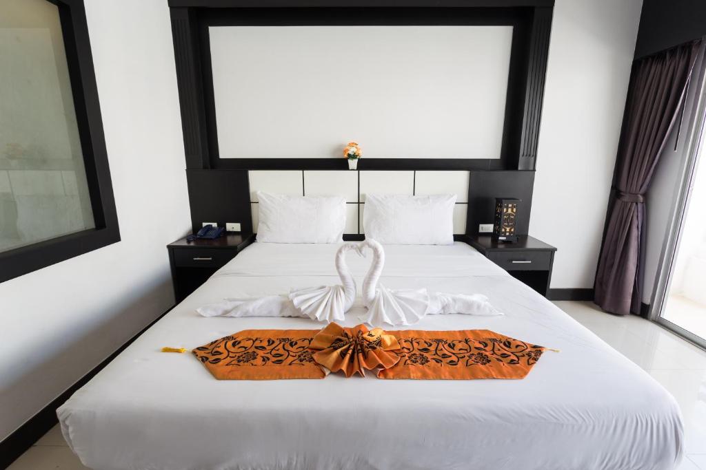 Postel nebo postele na pokoji v ubytování Star House Patong