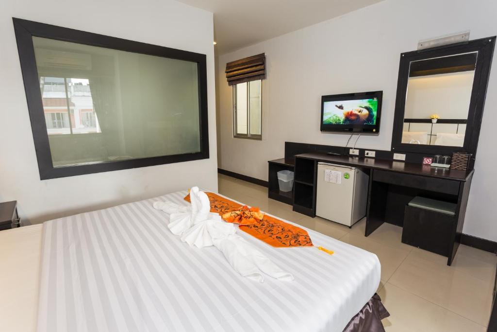 Postel nebo postele na pokoji v ubytování Star House Patong