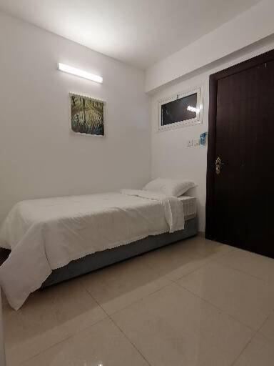 Letto o letti in una camera di Rayan Residence