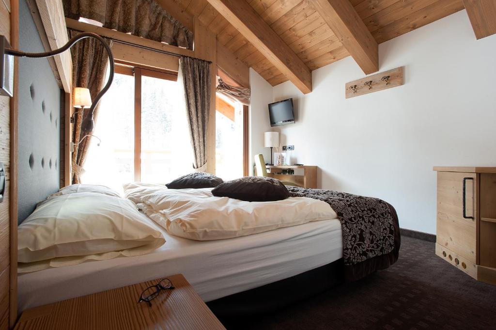Postel nebo postele na pokoji v ubytování Hotel Vedig