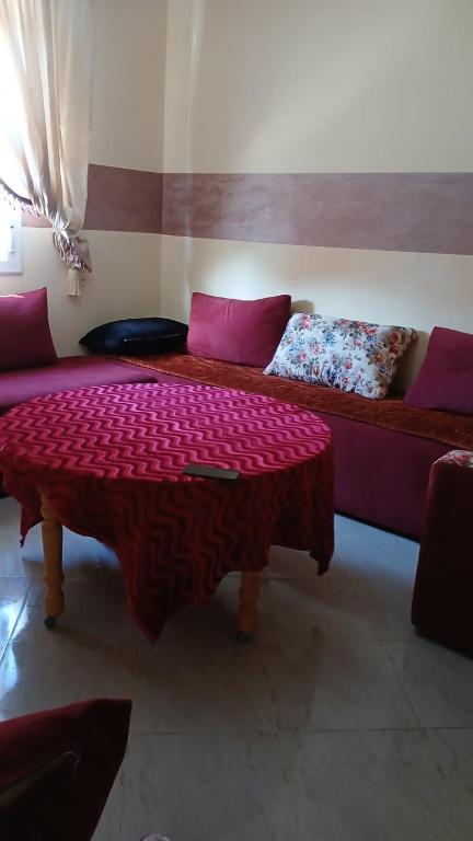 a living room with a couch and a table at Saidia appartments in Saïdia