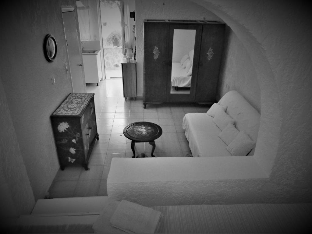 a living room with a couch and a table at Asklipion Valley guest house in Kos