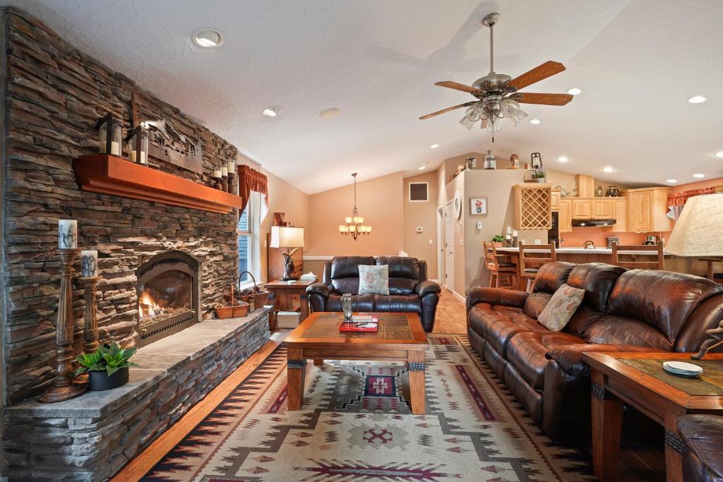 a living room with a couch and a fireplace at 164 Jillian - Private peaceful retreat in Three Rivers