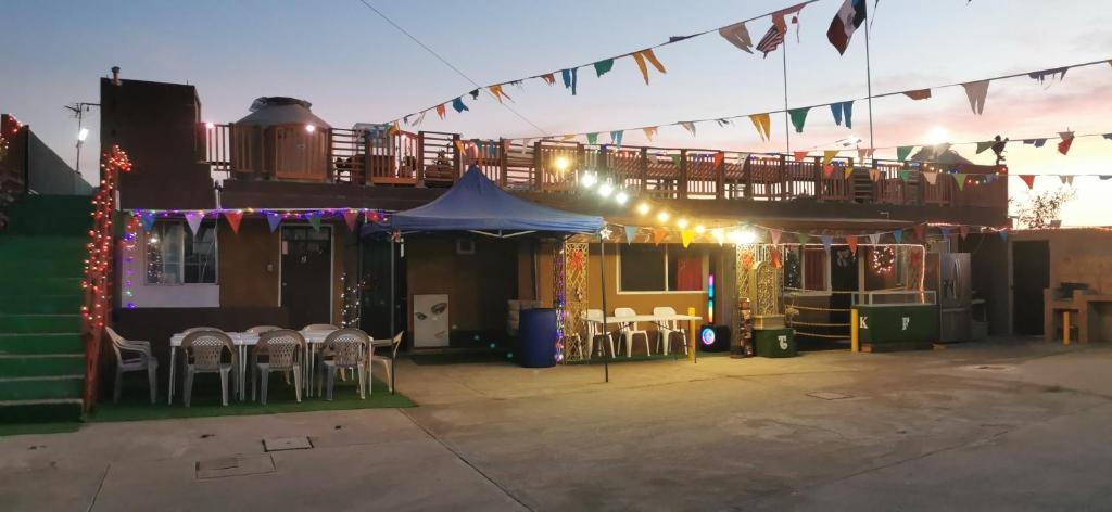 a patio with chairs and a tent with lights at Salón y habitaciones 783 in Rosarito Beach