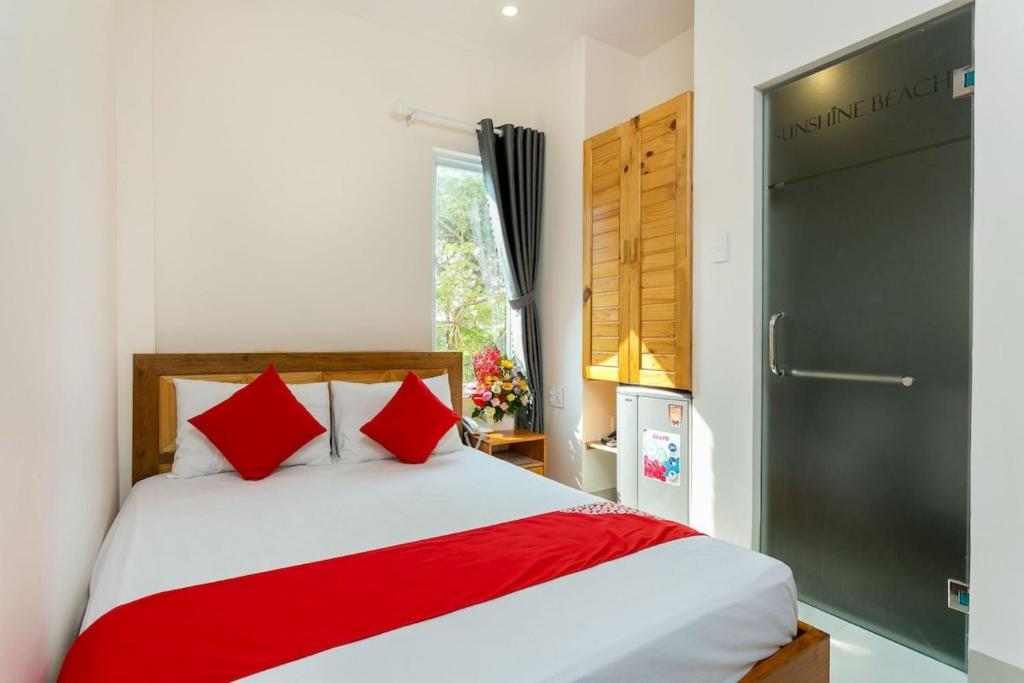 Postel nebo postele na pokoji v ubytování Sunshine Beach Da Nang
