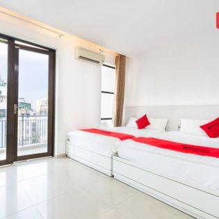 Postel nebo postele na pokoji v ubytování Khanh Linh Hotel