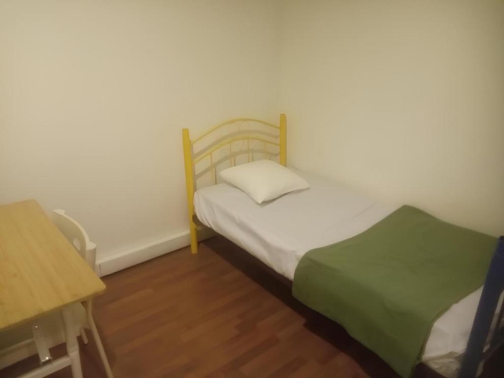 Postel nebo postele na pokoji v ubytování Natol Homestay - Hong Kong Rock Road