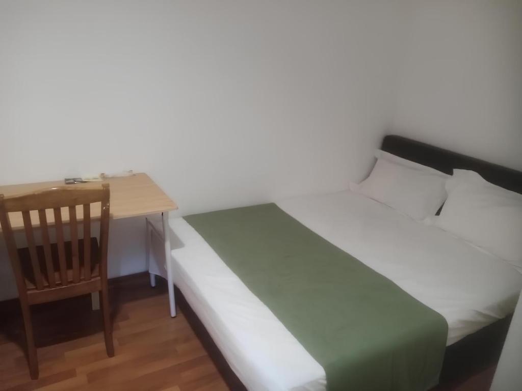 Postel nebo postele na pokoji v ubytování Natol Homestay - Hong Kong Rock Road
