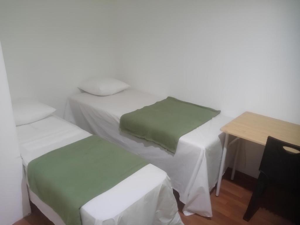 Postel nebo postele na pokoji v ubytování Natol Homestay - Hong Kong Rock Road