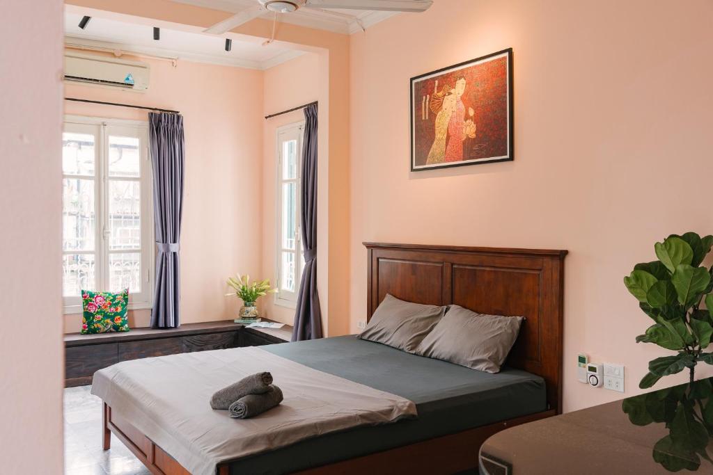Postel nebo postele na pokoji v ubytování An Nam Art House