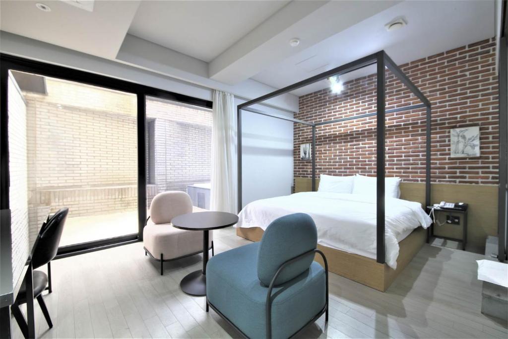 Postel nebo postele na pokoji v ubytování Seomyeon Hound Hotel 1st Street