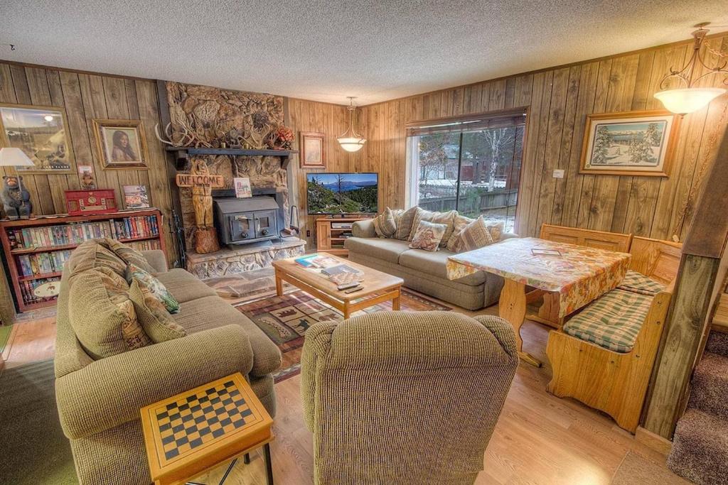 a living room with a couch and a table at Bambi's Bunkhouse home in South Lake Tahoe