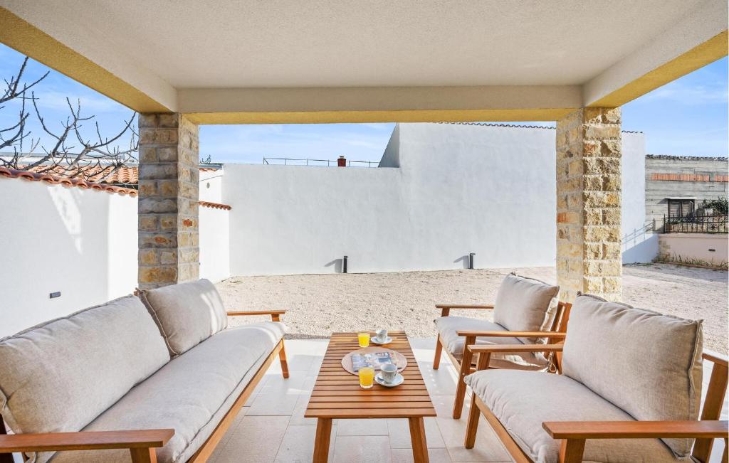 a living room with a couch and a table at 4 Bedroom Stunning Home In Vodice in Vodice