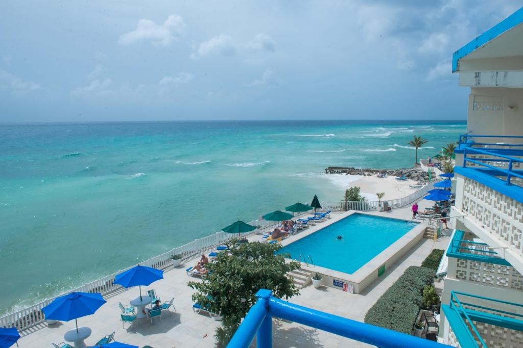 a view of the ocean from the balcony of a resort at Rostrevor Hotel in Christ Church