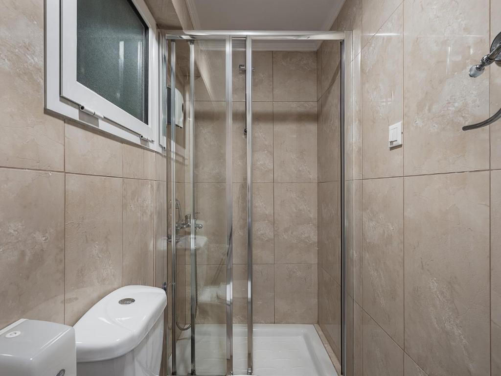 Koupelna v ubytování Theofilos City Hotel