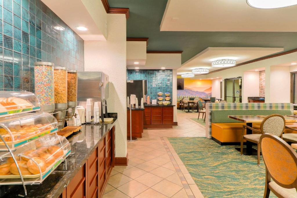 a fast food restaurant with a counter with food at Quality Inn Near the Island Pigeon Forge in Pigeon Forge
