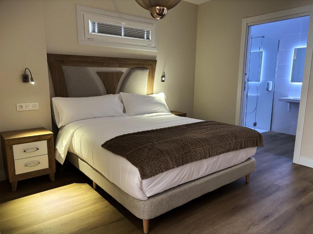 Postel nebo postele na pokoji v ubytování Hotel Bermeo