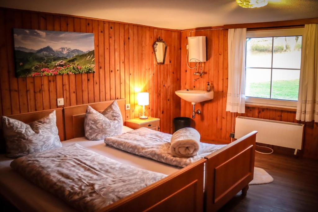 Postel nebo postele na pokoji v ubytování Bergoase Hohenegg
