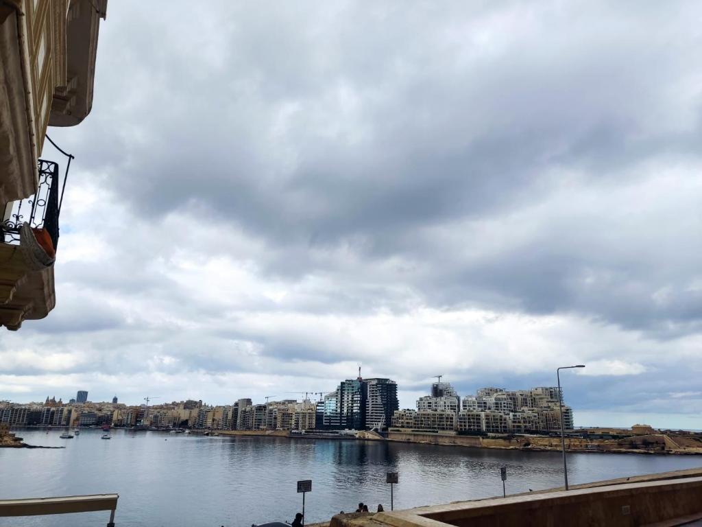 a view of a river with buildings and a city at Valletta Authentic Apartment in Valletta