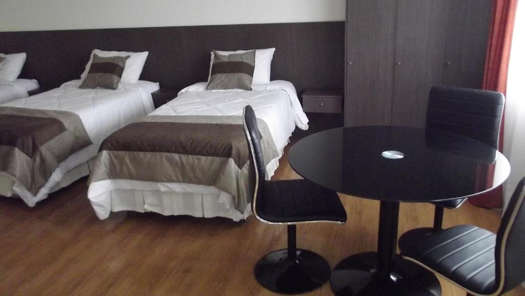 Postel nebo postele na pokoji v ubytování Vitrali Suite