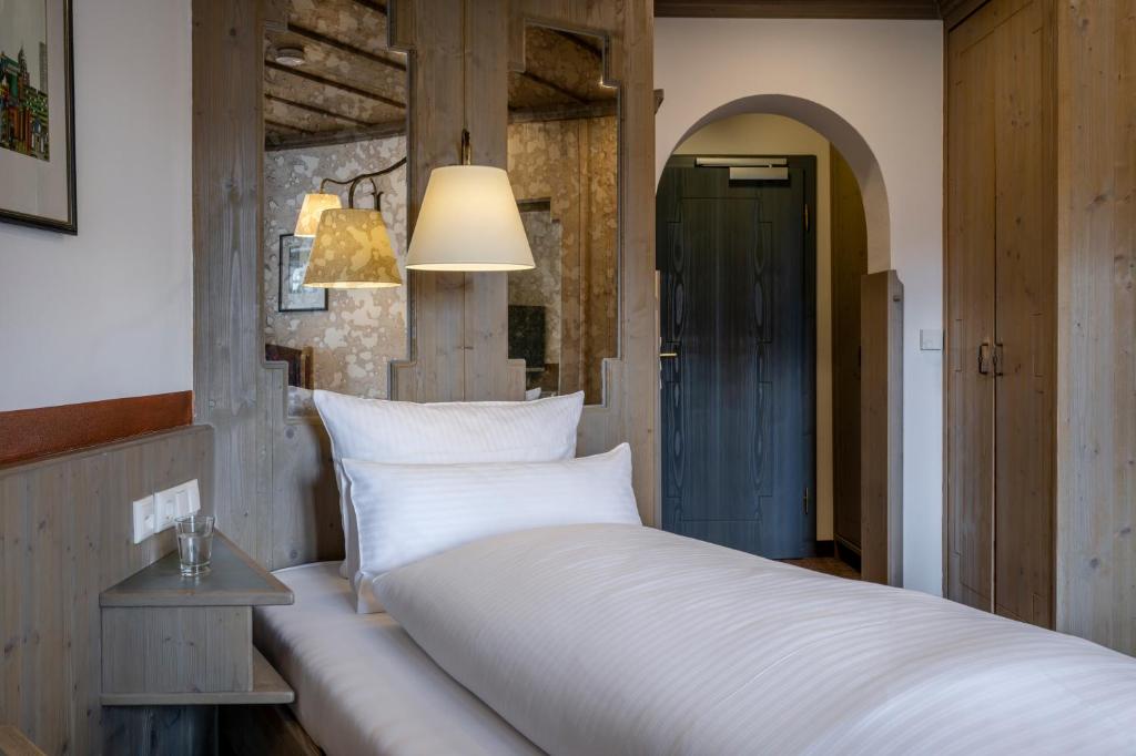 Postel nebo postele na pokoji v ubytování Hotel Promenade