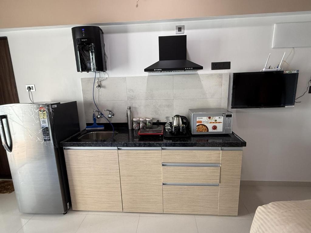 Kuchyň nebo kuchyňský kout v ubytování Abhibha Suites
