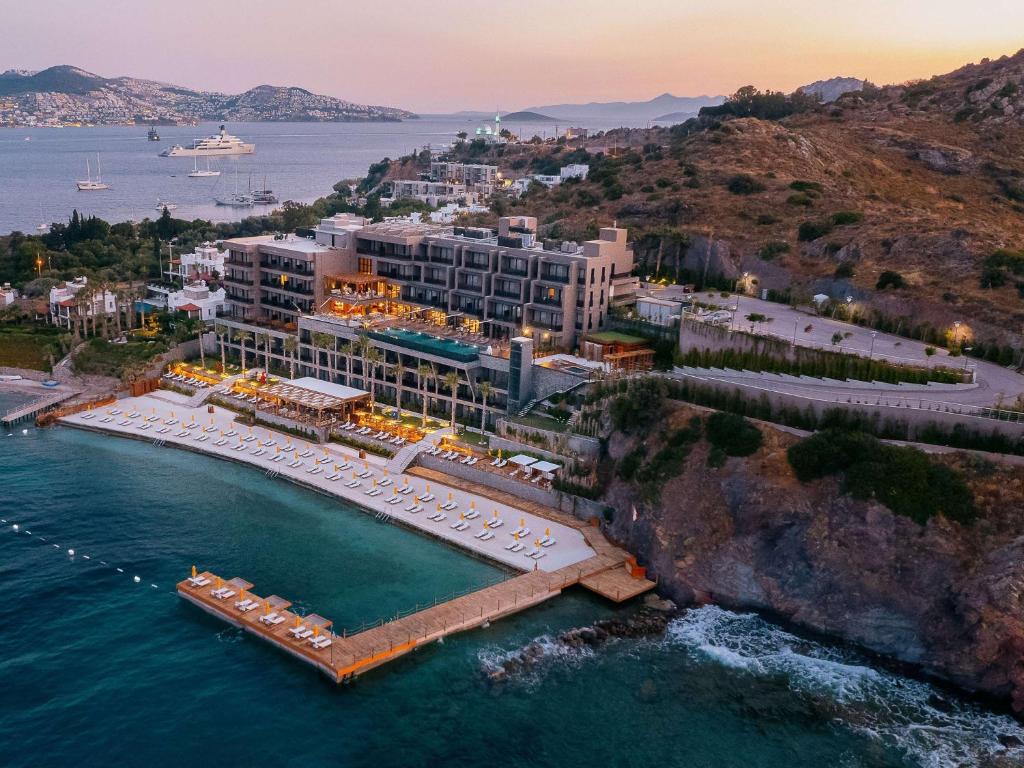 an aerial view of a resort on the water at The Bodrum Hotel Yalikavak - MGallery Collection in Yalıkavak
