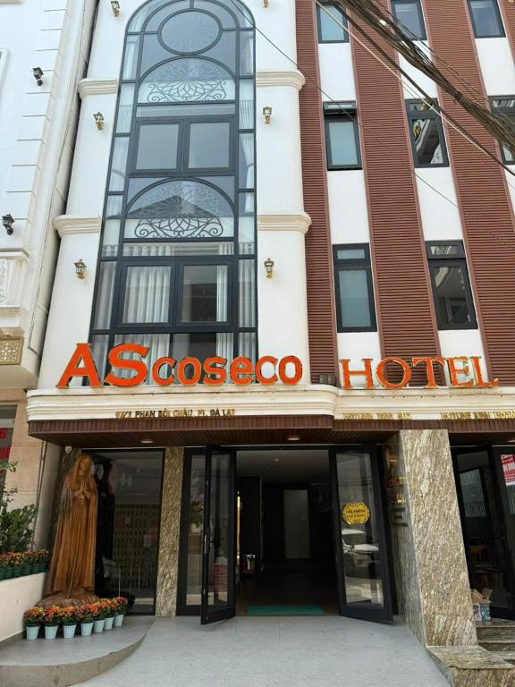 a building with an asocooco sign in front of it at AS Hotel Đà Lạt in Da Lat