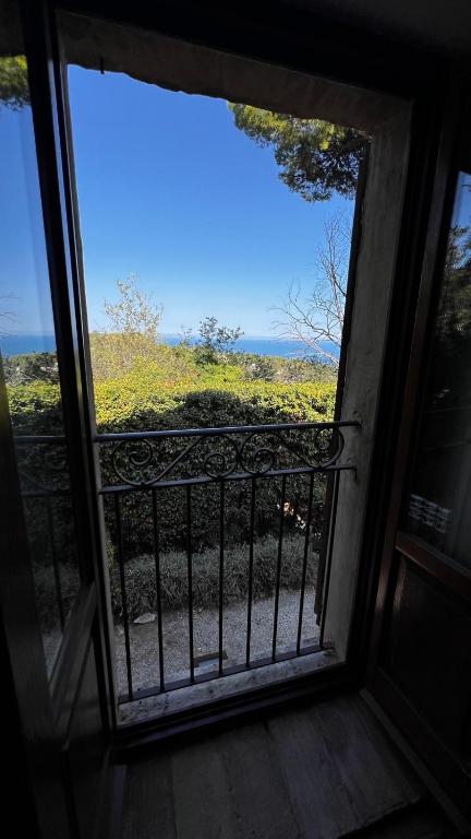 an open window with a view of a field at Villa Boccolini Appartamento in Sirolo
