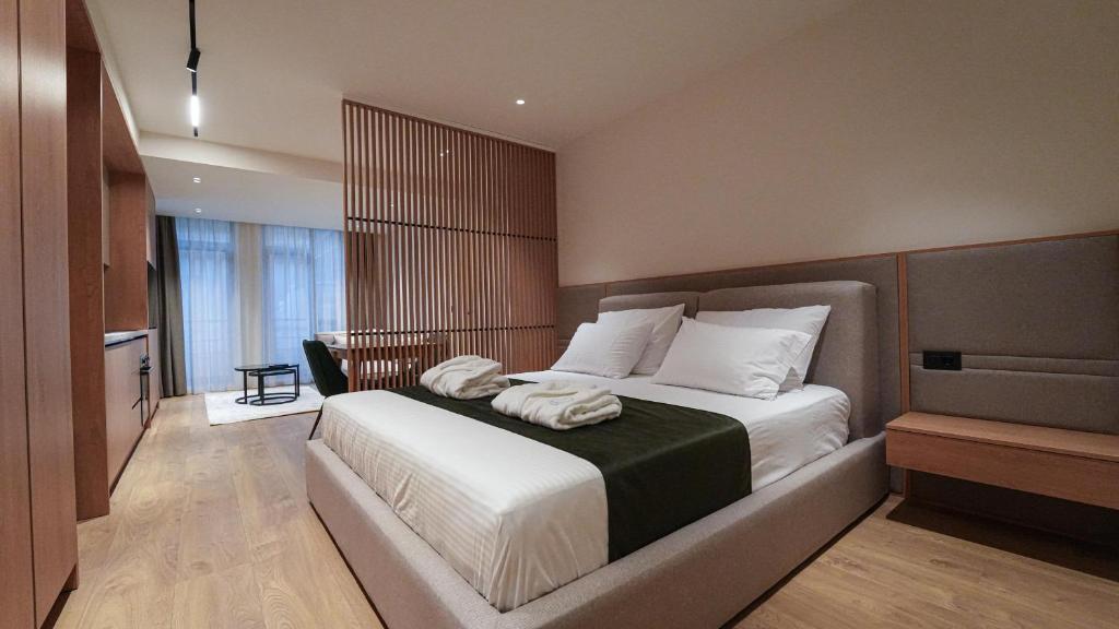 Postel nebo postele na pokoji v ubytování diVin Luxury Suites