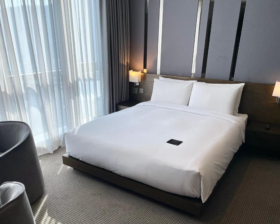 Postel nebo postele na pokoji v ubytování Centum Business Hotel