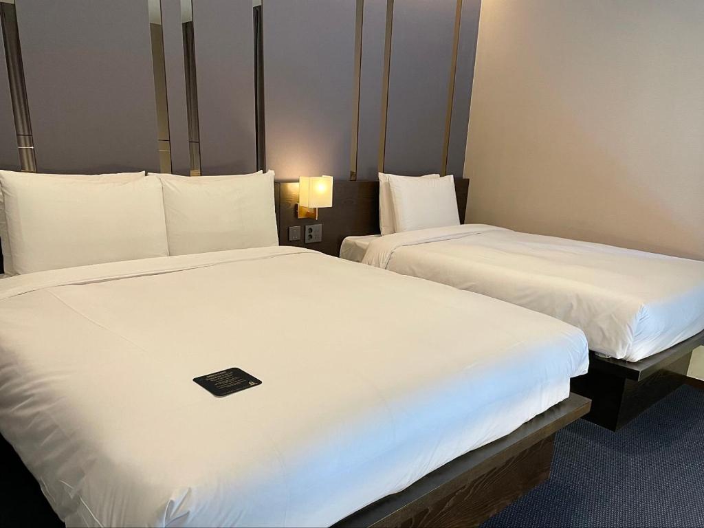 Postel nebo postele na pokoji v ubytování Centum Business Hotel