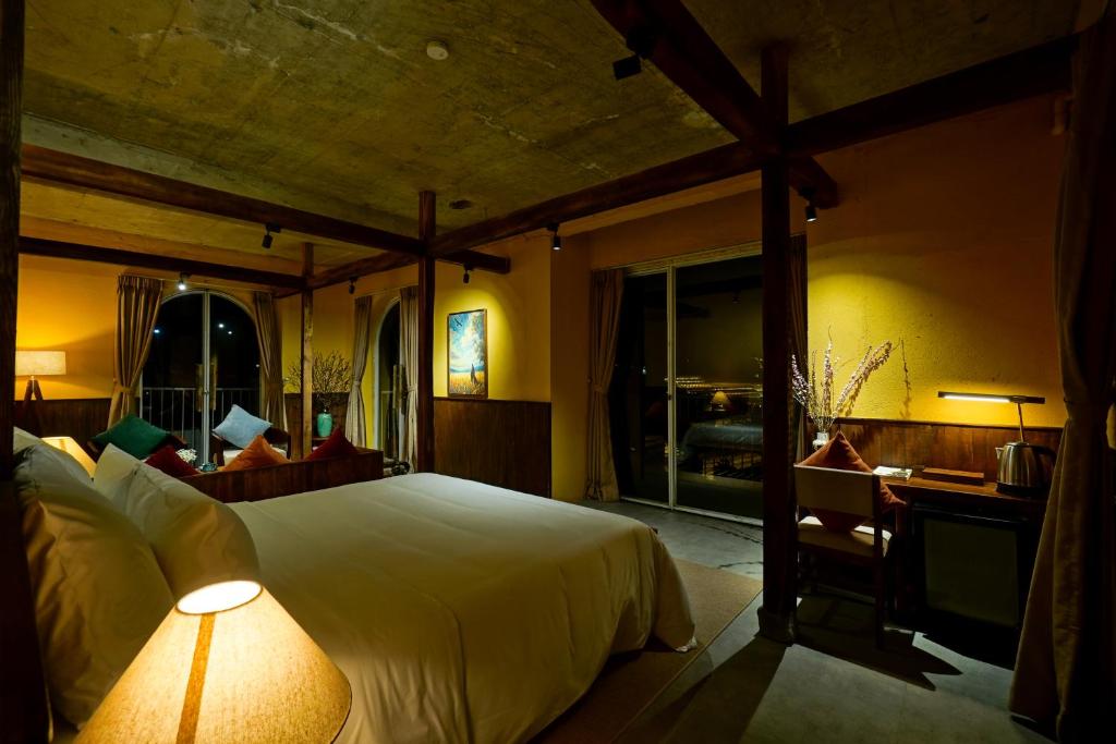 Giường trong phòng chung tại Nexus House An Son Da Lat