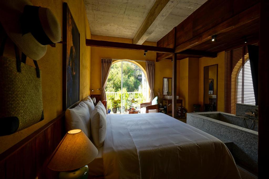 Giường trong phòng chung tại Nexus House An Son Da Lat