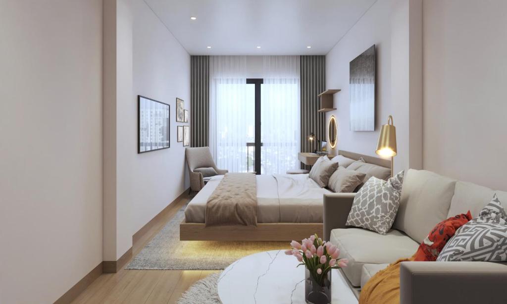 Giường trong phòng chung tại Le Petit Hotel & Travel