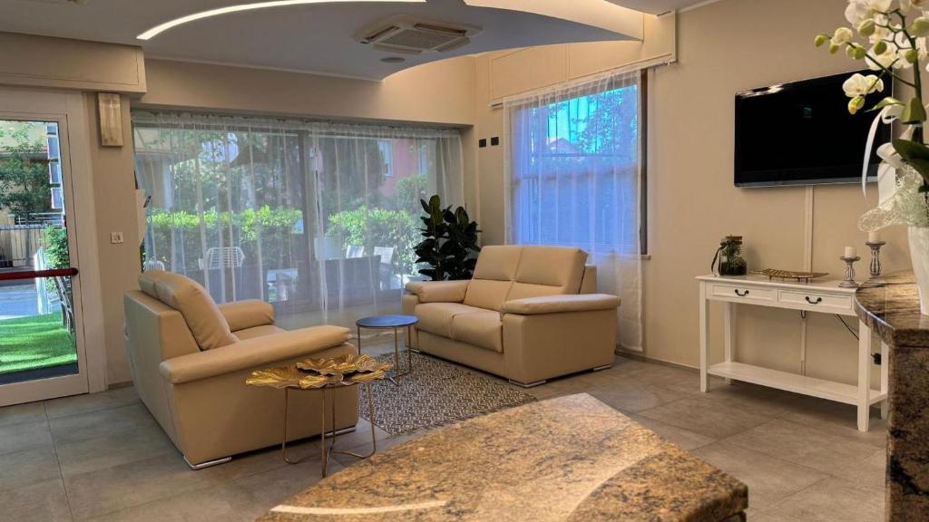 TV a/nebo společenská místnost v ubytování Hotel Quisisana