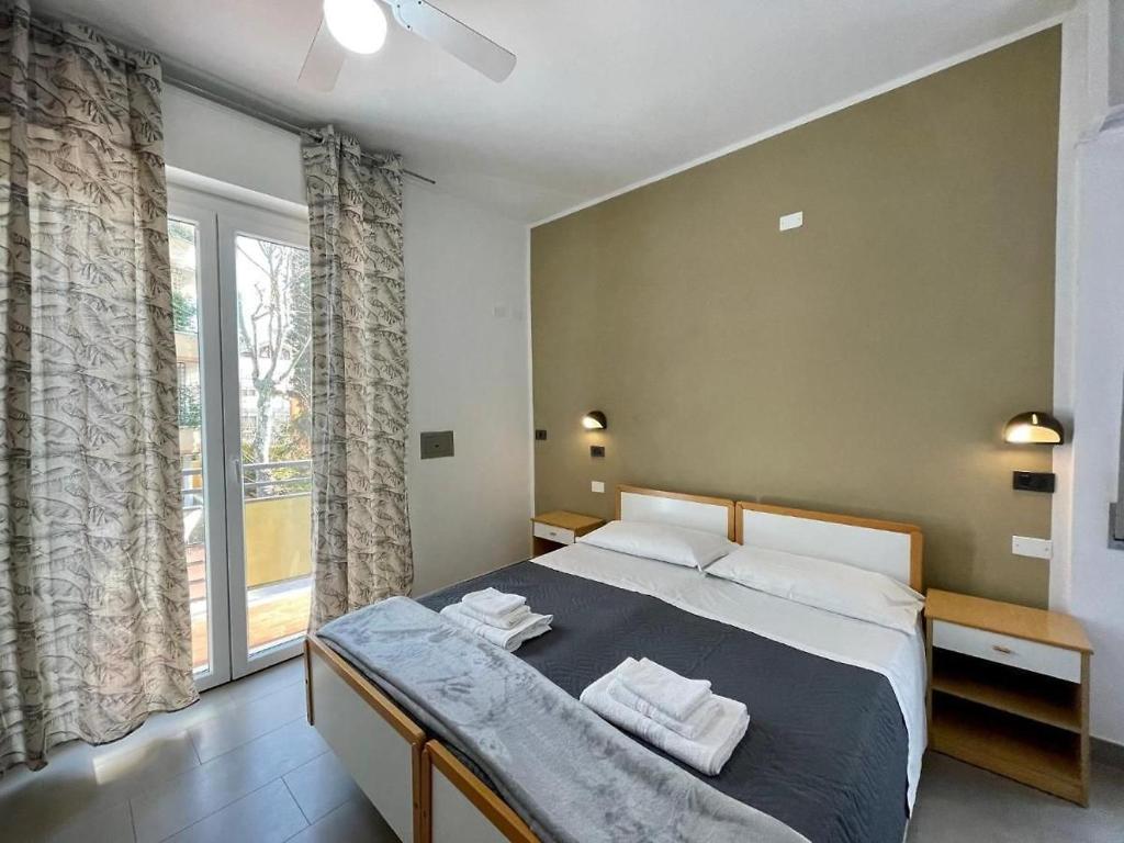 Postel nebo postele na pokoji v ubytování Hotel Quisisana
