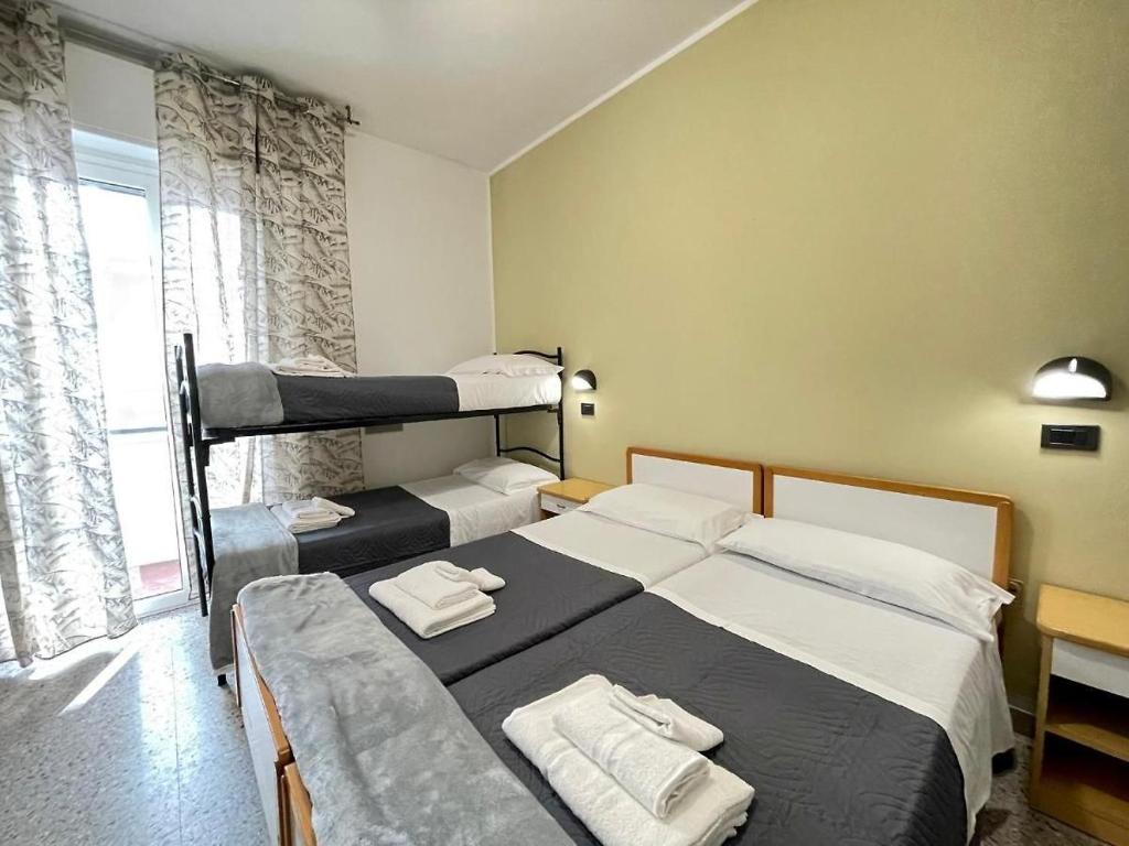 Postel nebo postele na pokoji v ubytování Hotel Quisisana