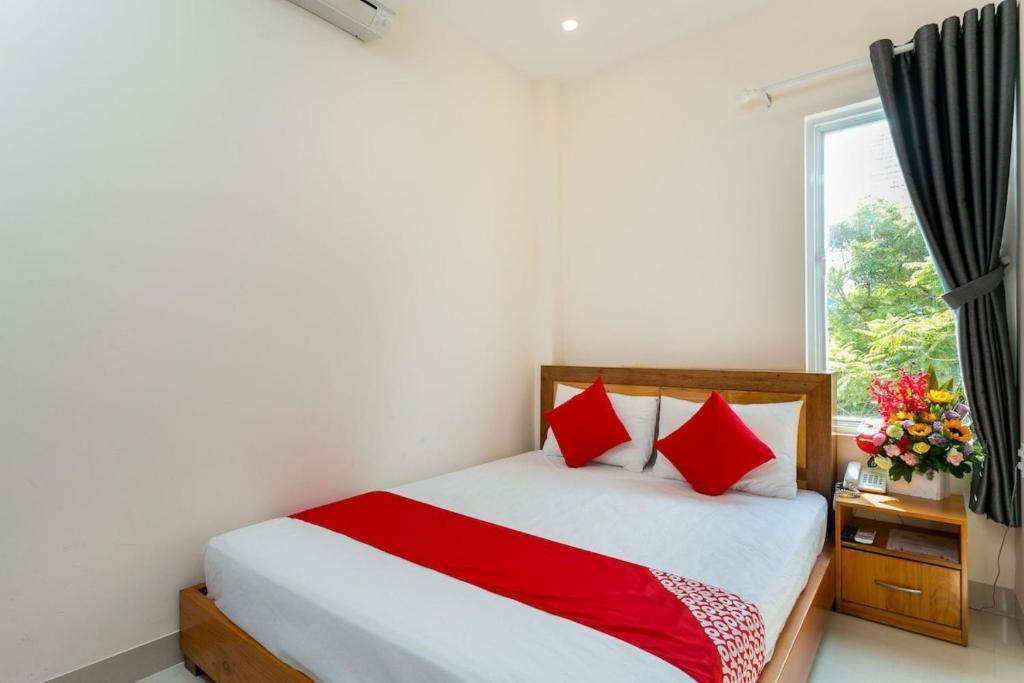 Postel nebo postele na pokoji v ubytování Sunshine Beach Da Nang